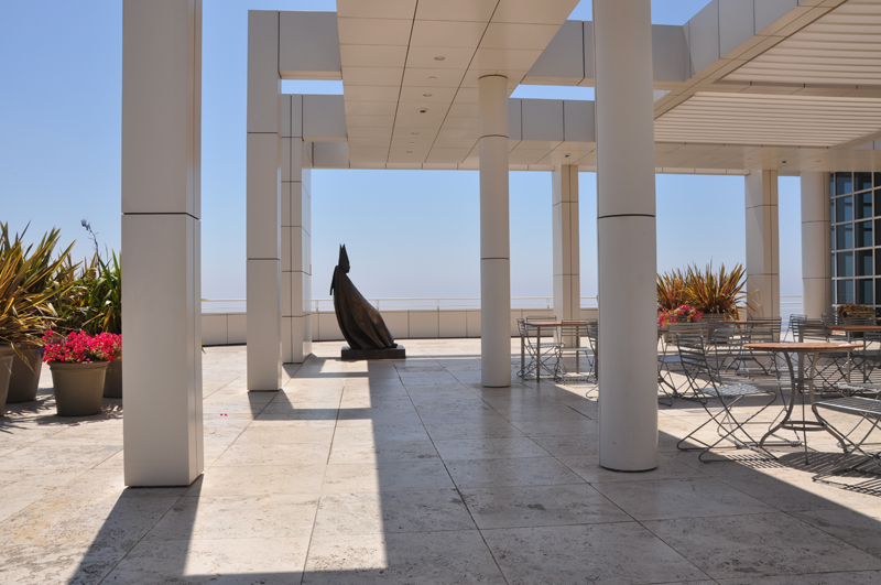 Stone bishop statue framed by textured background