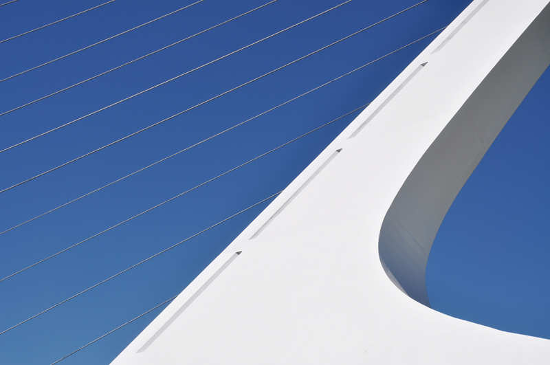 Long shot of a bridge over a river with early morning light