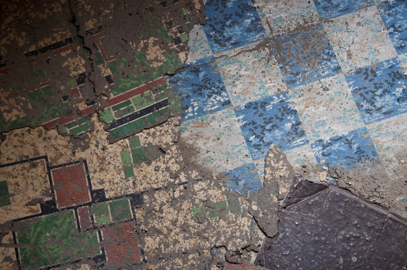 Close-up shot of worn wooden floorboards inside old building