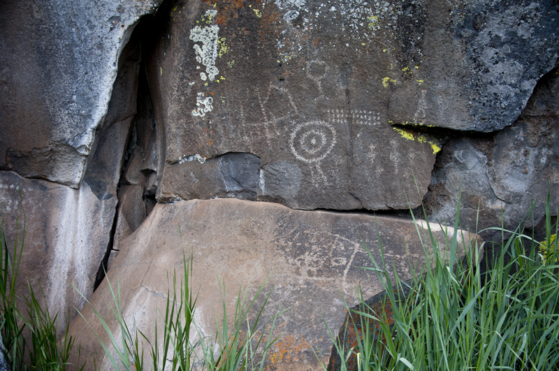 Ancient petroglyphs carved into stone surface
