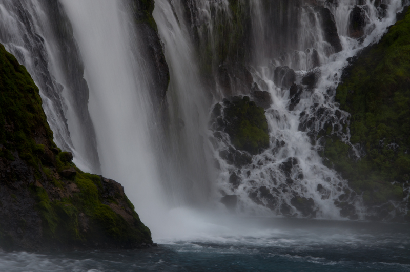 Waterfall cascading into rocky pool