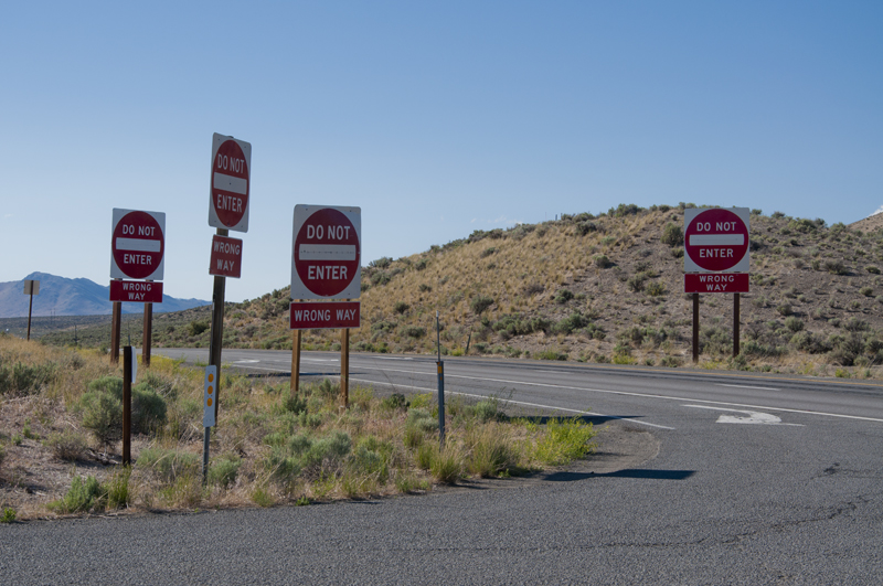 Directional sign reading 'Wrong Way'